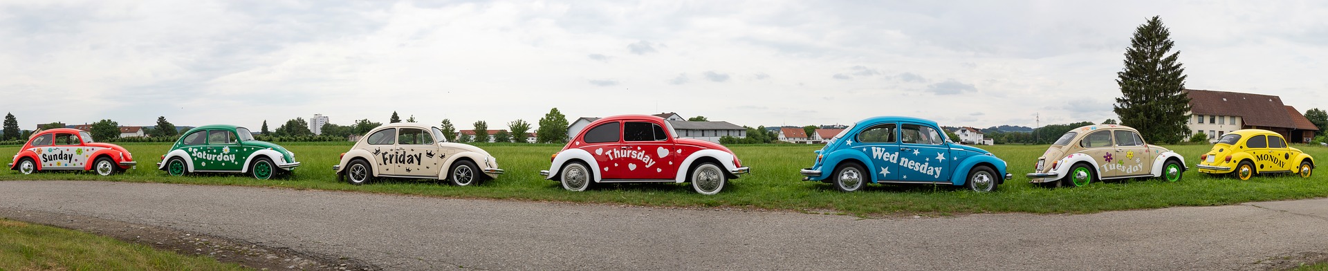 Volkswagen Bugs with days of the week printed on them