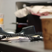 desk with phone handset off receiver