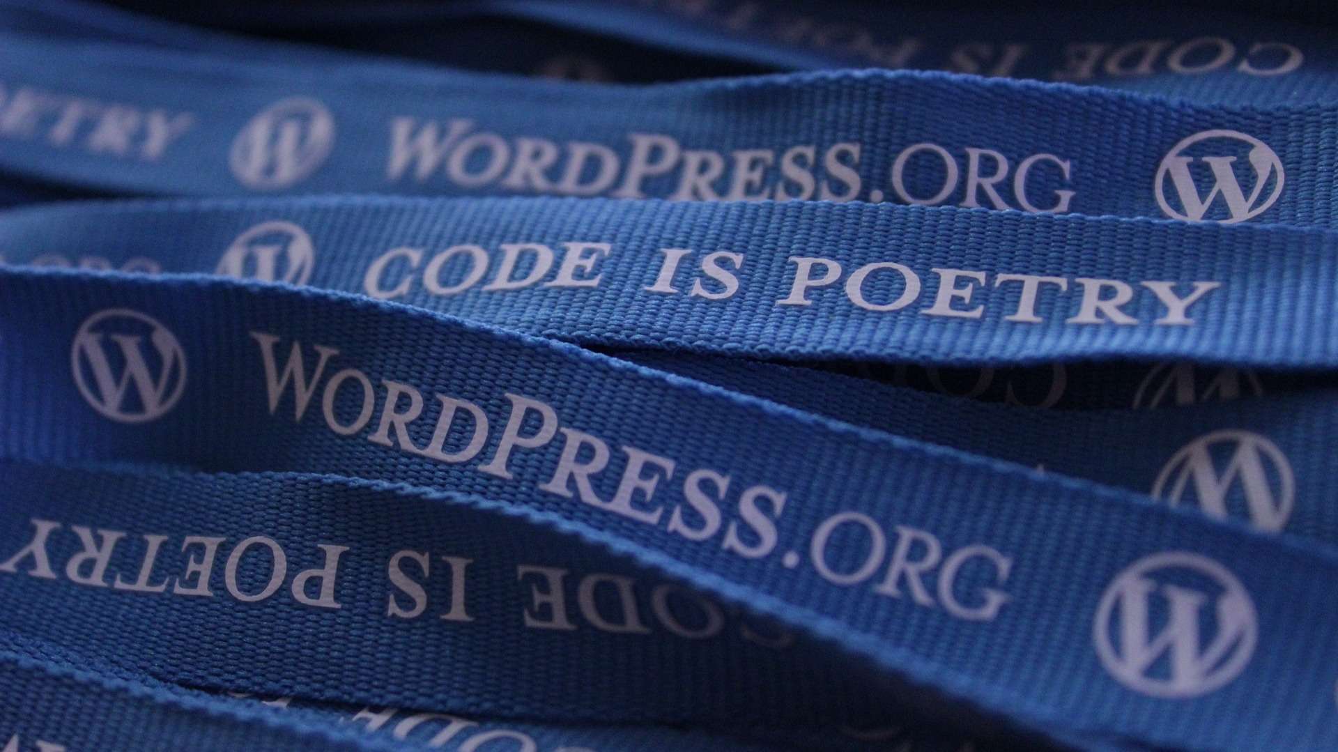 WordPress lanyards with label Code is Poetry